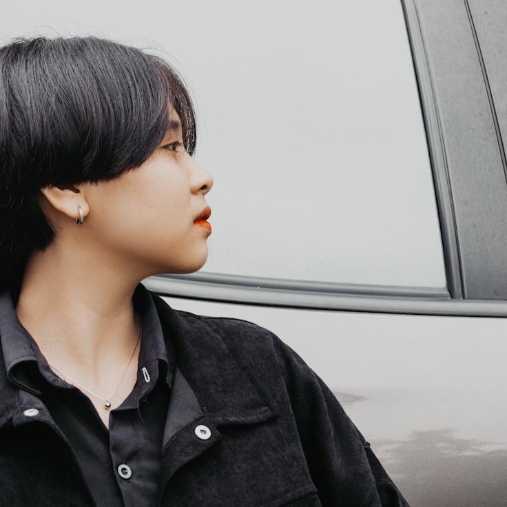 Alex Doe, Lead Design Curator at Harbor Paper Park, reviewing corporate floral arrangements